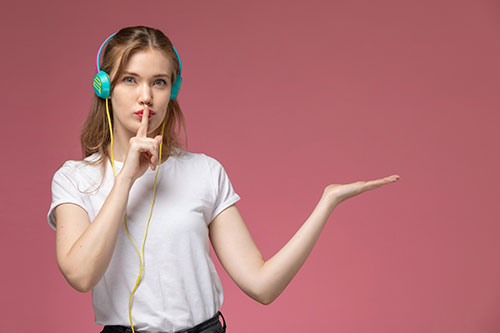Person with headphones listening attentively
