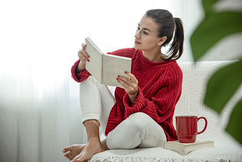 Person reading a book for language practice