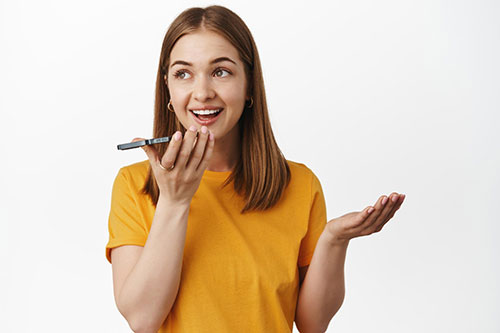 Person speaking into a microphone for practice